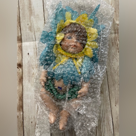 Collectible Porcelain Baby Doll Dressed in a Blue & Yellow Flower Costume - Picture 6 of 10